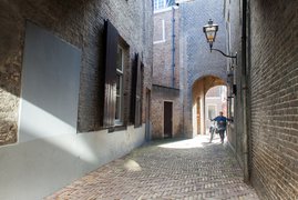Old alley with arch passage