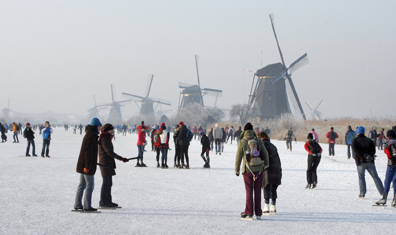 Ice skating near historical windmills Kinderdijk